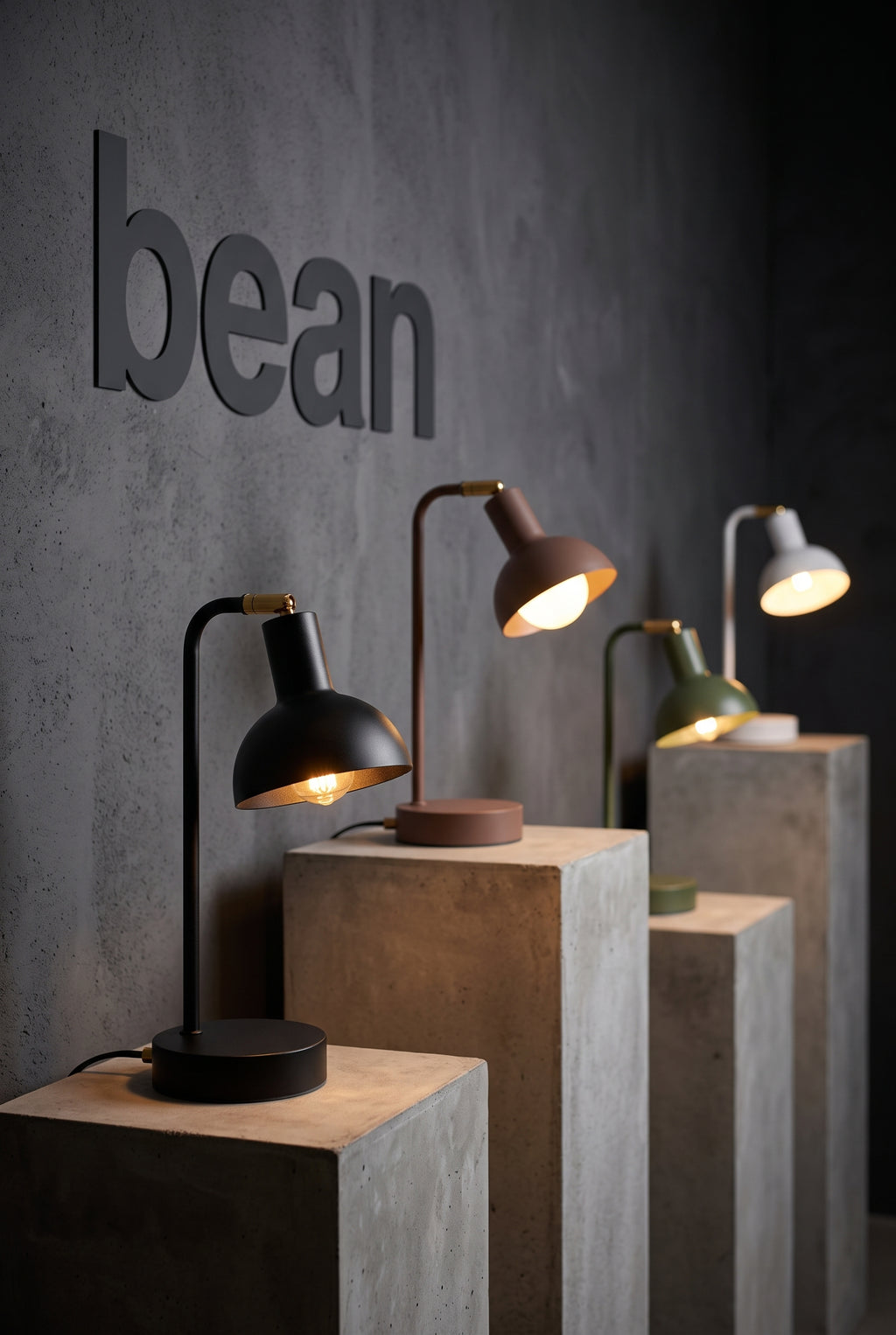 Bean table lamps in all colours on plinths, showroom display